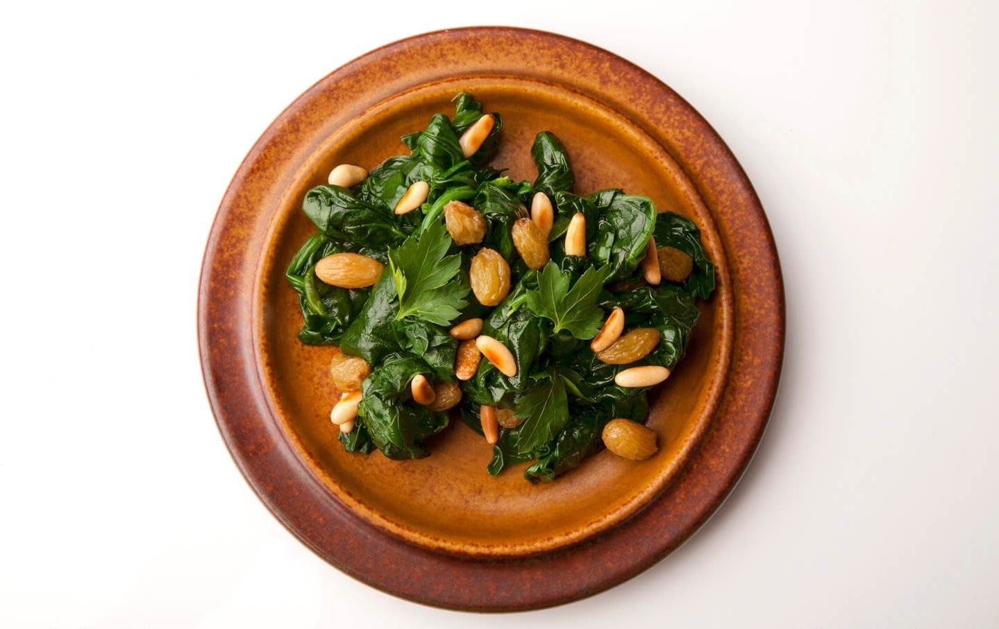 spinach-with-pine-nuts-raisins-sauteed